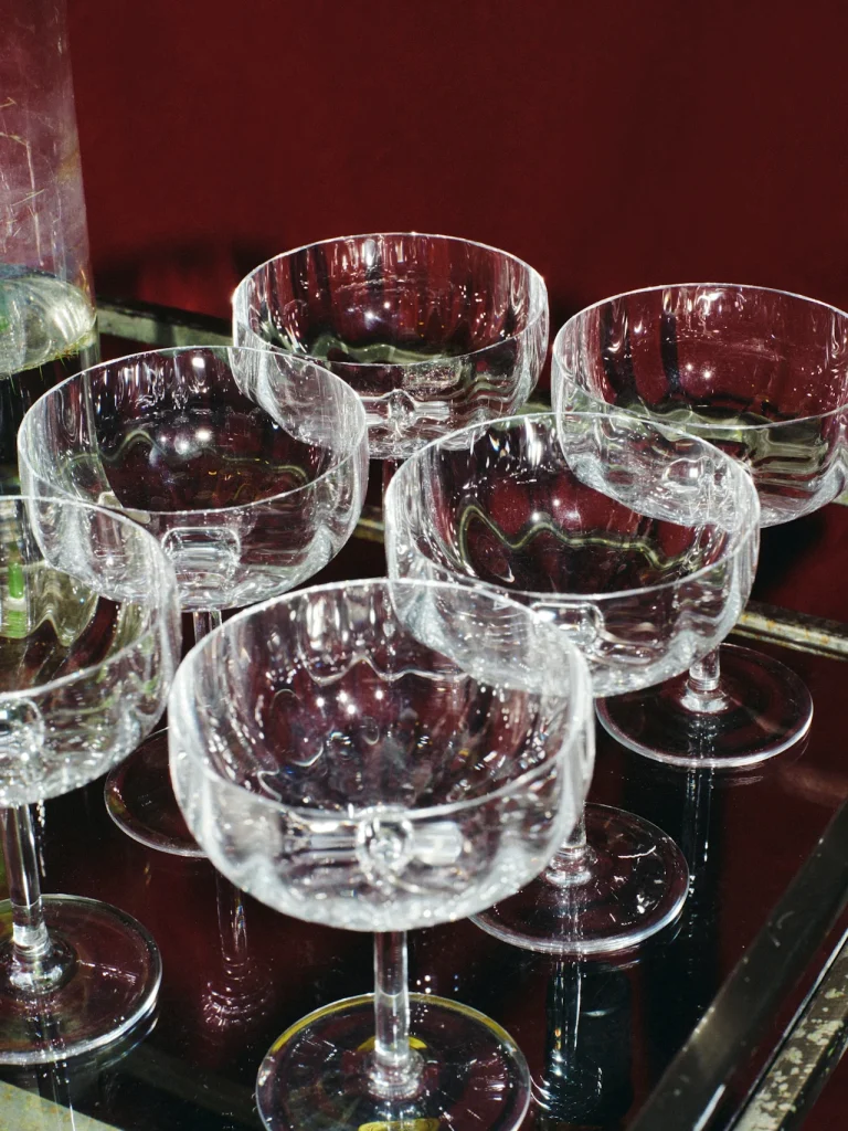 Set of six crystal champagne coupe glasses.