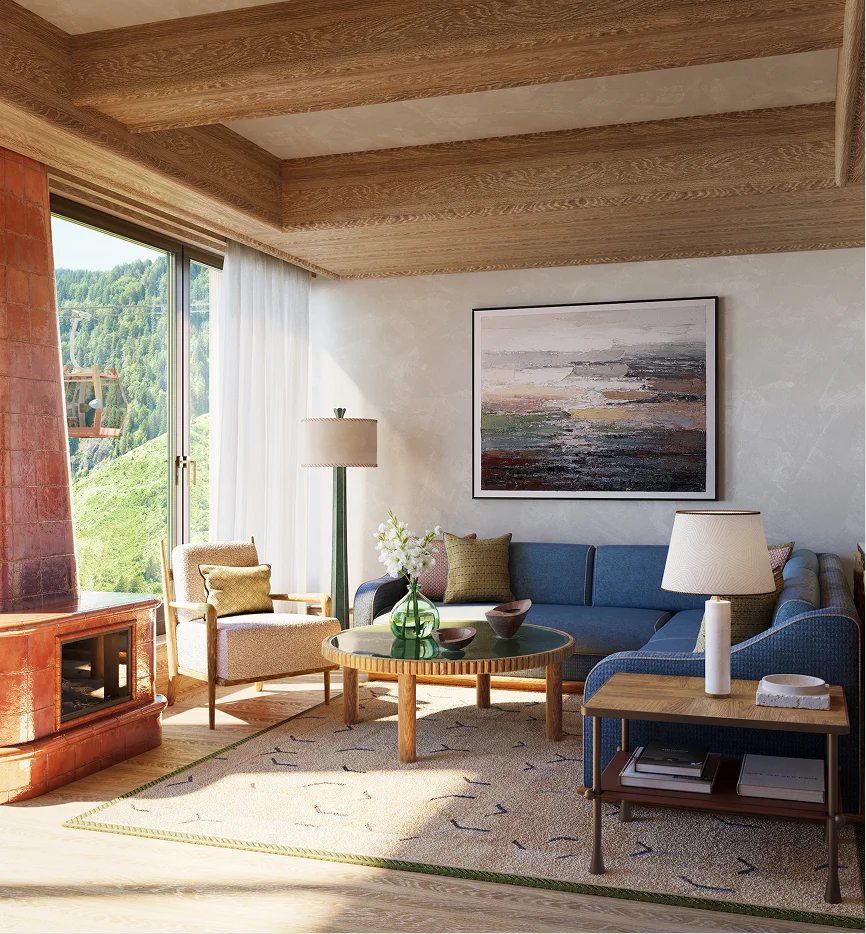Cozy modern living room with blue sofa, armchair, coffee table, and large window overlooking a green hillside.