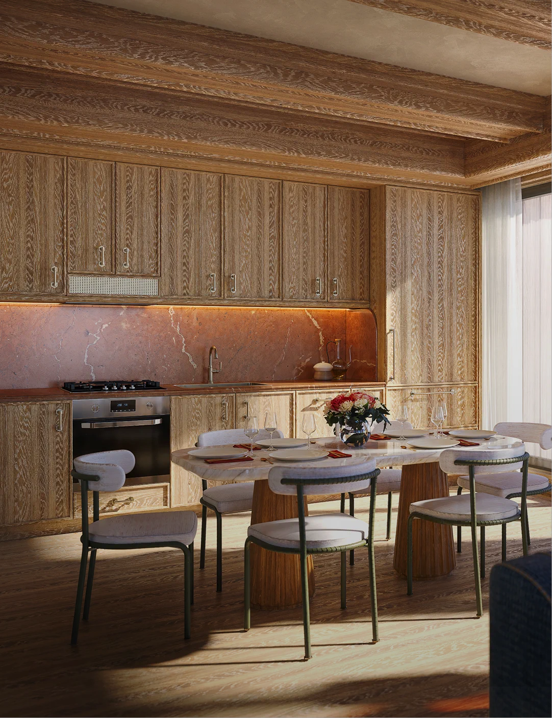 Modern kitchen with light wood cabinetry, a dining table set for a meal, and soft lighting.